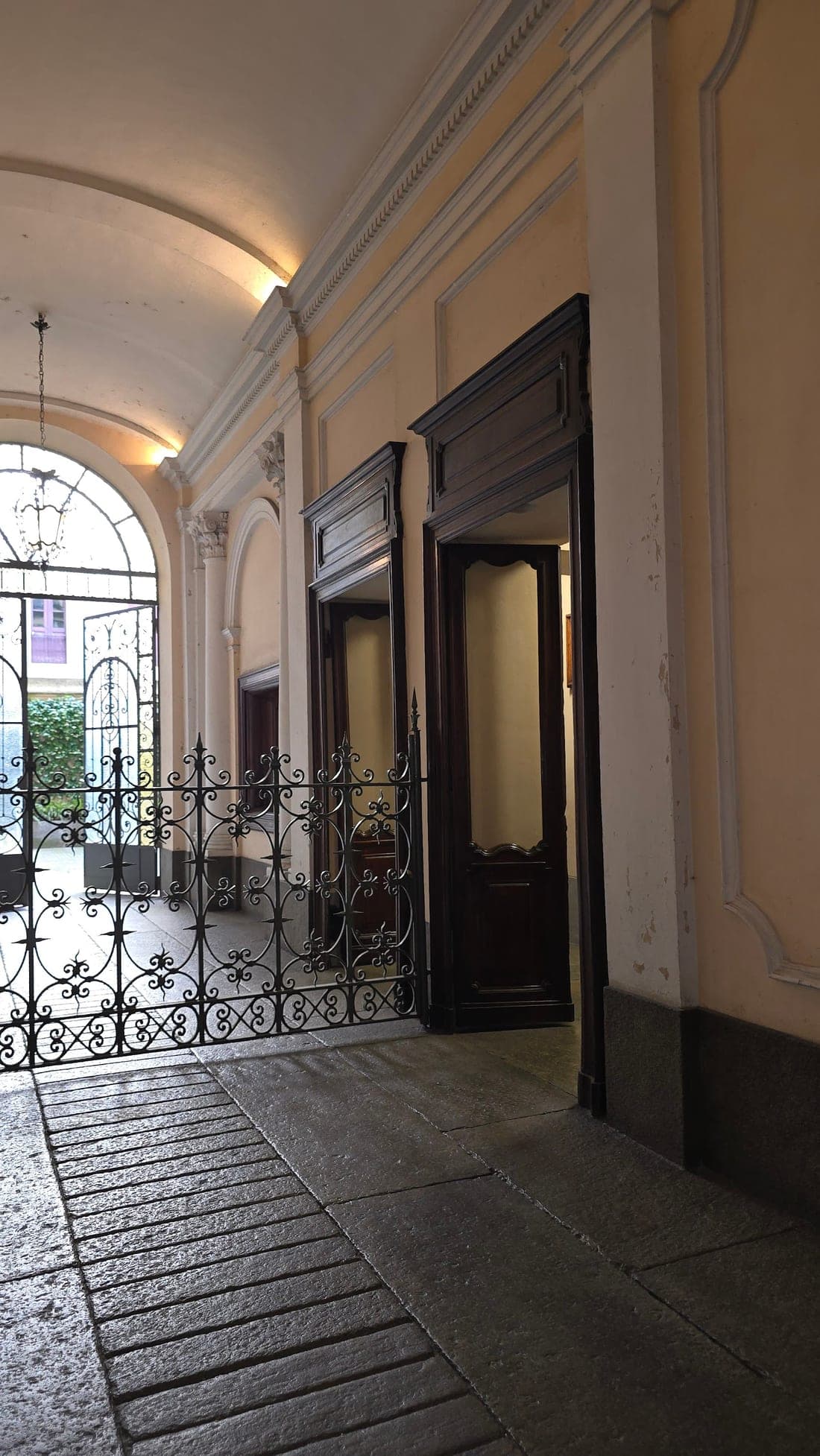 Portico entrance of the office in a historic Turin building